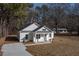 Beautiful single-story home featuring a covered front porch, new driveway, and mature trees at 00 Cedar Grove Church Rd Rd, Roxboro, NC 27574