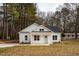 Charming one story home with concrete driveway, white siding, and black roof at 00 Cedar Grove Church Rd Rd, Roxboro, NC 27574