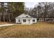 Charming one story home with concrete driveway, white siding, and black roof at 00 Cedar Grove Church Rd Rd, Roxboro, NC 27574