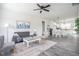 Inviting living room with gray seating, wood-look floors, and an open layout to the eat-in kitchen at 00 Cedar Grove Church Rd Rd, Roxboro, NC 27574