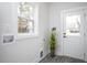 Neutral mud room with wood-look floors, white trim and a door to the outside at 00 Cedar Grove Church Rd Rd, Roxboro, NC 27574