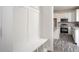 Mudroom with a bench and storage cubbies leads into the kitchen with stainless appliances at 00 Cedar Grove Church Rd Rd, Roxboro, NC 27574