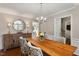 Elegant dining room boasts a wooden table, stylish chairs, and a decorative mirror at 100 Beech Forest Ct, Cary, NC 27513