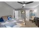 Bright bedroom with neutral walls, fan and ample closet space at 131 Carriage House Trl, Garner, NC 27529