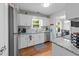 Well-lit kitchen featuring granite countertops and modern appliances at 131 Carriage House Trl, Garner, NC 27529