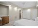 Cozy bedroom with a double door closet, neutral walls, and a ceiling fan at 1402 Princess Anne Rd, Cary, NC 27513