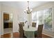 Cozy dining room with bright windows and hardwood floors, perfect for intimate gatherings at 1402 Princess Anne Rd, Cary, NC 27513