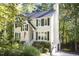 Charming two-story traditional home with light yellow siding, black shutters, and a well-manicured front yard at 1402 Princess Anne Rd, Cary, NC 27513