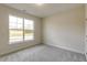 A bright bedroom features a large window offering a view of the outdoors at 1758 Daiquiri Turn, Sanford, NC 27332