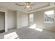 Bedroom with plush gray carpeting, windows, and white trim at 1758 Daiquiri Turn, Sanford, NC 27332