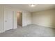 Comfortable bedroom with neutral carpet and multiple closets for storage at 1758 Daiquiri Turn, Sanford, NC 27332