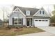 Charming home with a two-car garage, landscaped front yard, and inviting front door at 1758 Daiquiri Turn, Sanford, NC 27332