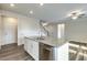 Bright kitchen featuring a granite island with stainless steel appliances and white cabinets at 1758 Daiquiri Turn, Sanford, NC 27332