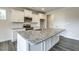 Kitchen island featuring a granite countertop and stainless steel sink and appliances at 1758 Daiquiri Turn, Sanford, NC 27332