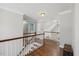 Spacious foyer showcasing hardwood floors and a view to the bathroom at 208 Gentlewoods Dr, Cary, NC 27518