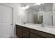 Bathroom with double vanity, quartz countertop, large mirror, and glass door shower at 231 Frosted Iris Lane Ln # 174, Garner, NC 27529