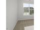 Bright bedroom with neutral carpet, a large window, and white walls at 231 Frosted Iris Lane Ln # 174, Garner, NC 27529