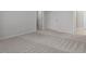 Spacious bedroom with neutral carpeting, open doorway and ensuite bathroom at 231 Frosted Iris Lane Ln # 174, Garner, NC 27529