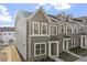 Attractive townhome with brick and siding facade, large windows and manicured lawn at 231 Frosted Iris Lane Ln # 174, Garner, NC 27529