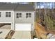Two-story home with gray siding, a one car garage, and a gray roof at 231 Frosted Iris Lane Ln # 174, Garner, NC 27529