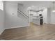 Open concept kitchen with hardwood floors and white cabinetry at 231 Frosted Iris Lane Ln # 174, Garner, NC 27529