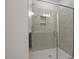 Modern glass door shower with rainfall shower head and built-in niche for storage at 231 Frosted Iris Lane Ln # 174, Garner, NC 27529