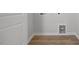 Utility room with wood-look floors and hookups for a washer and dryer at 231 Frosted Iris Lane Ln # 174, Garner, NC 27529