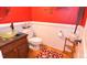 Stylish bathroom with a vessel sink, wainscoting, and decorative wall accents at 2701 Erinridge Road Rd, Raleigh, NC 27610