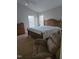 Large Primary bedroom featuring wood furniture, and comfortable sitting area at 2701 Erinridge Road Rd, Raleigh, NC 27610
