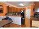 View of kitchen featuring wooden cabinets, granite countertops, and stainless steel appliances at 2701 Erinridge Road Rd, Raleigh, NC 27610