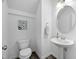 Stylish half-bath features modern fixtures, a sleek sink, and tasteful decor at 2959 Sunflower Rd, Apex, NC 27502