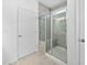 Modern bathroom with a glass-enclosed shower and tiled floor at 2959 Sunflower Rd, Apex, NC 27502