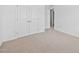 Clean bedroom with double doors and neutral carpet, ready for personalization at 2959 Sunflower Rd, Apex, NC 27502