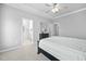 Bright bedroom with neutral walls, plush carpeting and an en-suite bathroom at 2959 Sunflower Rd, Apex, NC 27502