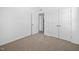 Carpeted bedroom with large closet space at 2959 Sunflower Rd, Apex, NC 27502
