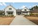 Stunning white farmhouse-style community clubhouse with black trim and inviting entrance at 2959 Sunflower Rd, Apex, NC 27502