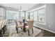 Dining room with large windows and a stylish modern chandelier at 2959 Sunflower Rd, Apex, NC 27502