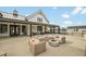 Community fire pit with seating and view of community clubhouse at 2959 Sunflower Rd, Apex, NC 27502