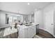 Open-concept kitchen with a modern island, adjacent to the dining area at 2959 Sunflower Rd, Apex, NC 27502