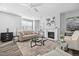 Cozy living room features a fireplace, comfortable seating, and hardwood floors at 2959 Sunflower Rd, Apex, NC 27502
