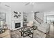 Stylish living room with fireplace, hardwood floors, and neutral paint at 2959 Sunflower Rd, Apex, NC 27502