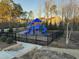 Community playground with bright blue playset and safety fencing for children to enjoy at 2959 Sunflower Rd, Apex, NC 27502