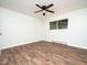 Bedroom features a ceiling fan, a window, and wood-style flooring at 3 Shepherd Ln # Bldg C, Chapel Hill, NC 27514