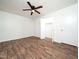Spacious bedroom with a ceiling fan, a closet and wood-style flooring at 3 Shepherd Ln # Bldg C, Chapel Hill, NC 27514