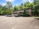 Apartment building with ample parking nestled in a well-maintained and tree-lined community at 3 Shepherd Ln # Bldg C, Chapel Hill, NC 27514
