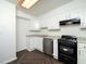 Bright kitchen featuring white cabinets, a window, modern appliances, and stylish flooring at 3 Shepherd Ln # Bldg C, Chapel Hill, NC 27514