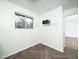 Room view featuring modern flooring, a microwave, and a window at 3 Shepherd Ln # Bldg C, Chapel Hill, NC 27514