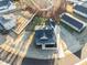 Overhead shot showcasing the property, including the lawn and the tree-covered surroundings at 304 Ashley Woods Ct, Clayton, NC 27527