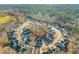 Panoramic aerial shot of a community with a circular street arrangement nestled in a leafy setting at 304 Ashley Woods Ct, Clayton, NC 27527