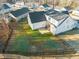 Aerial view of a large, fenced backyard, showing the layout of the lawn and surrounding neighborhood at 304 Ashley Woods Ct, Clayton, NC 27527